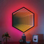 Hexagon Custom Infinity LED Mirror with orange 3D tunnel light effect, architectural wall decor above a wooden sideboard.