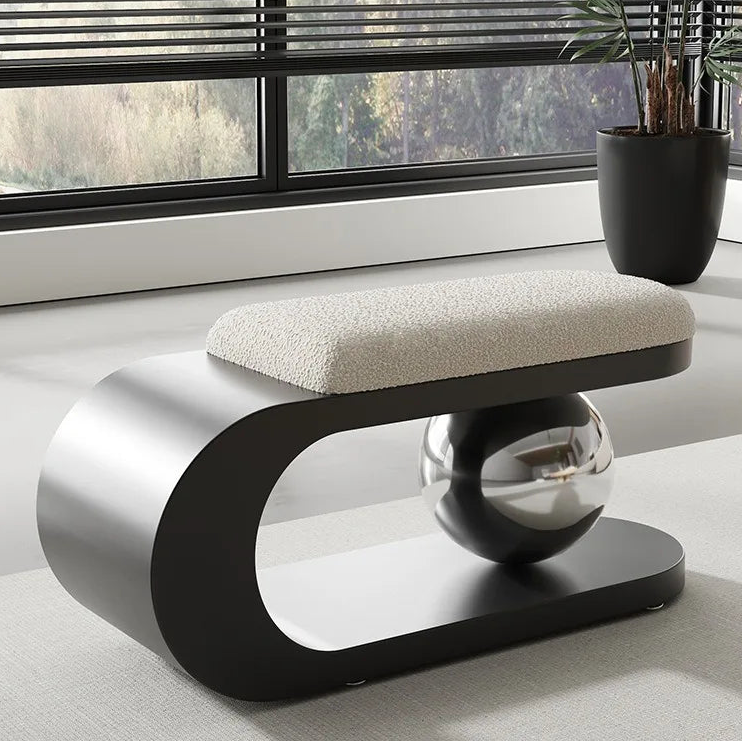 Modern bench with spherical design in a room with large windows
